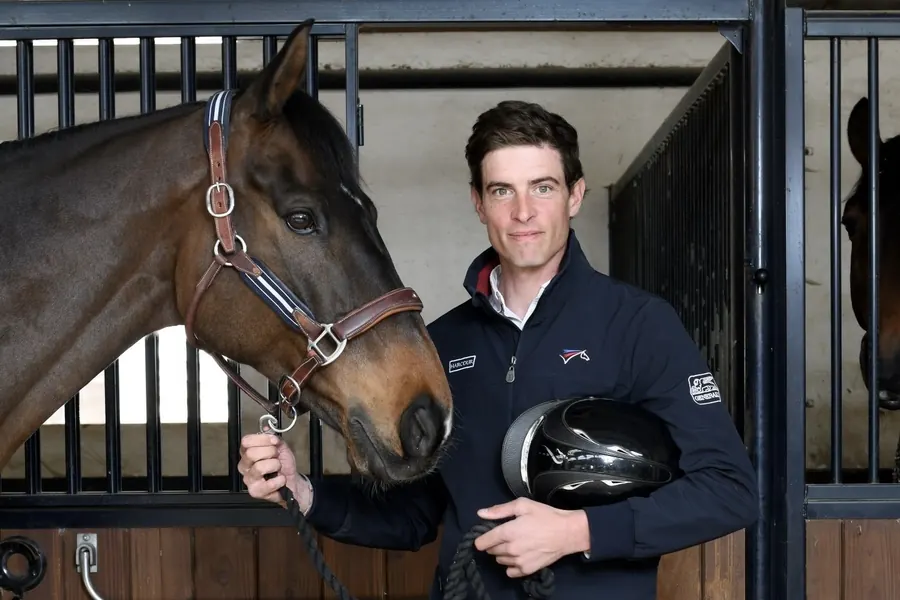 Maxime Livio riding cross-country at an eventing competition.