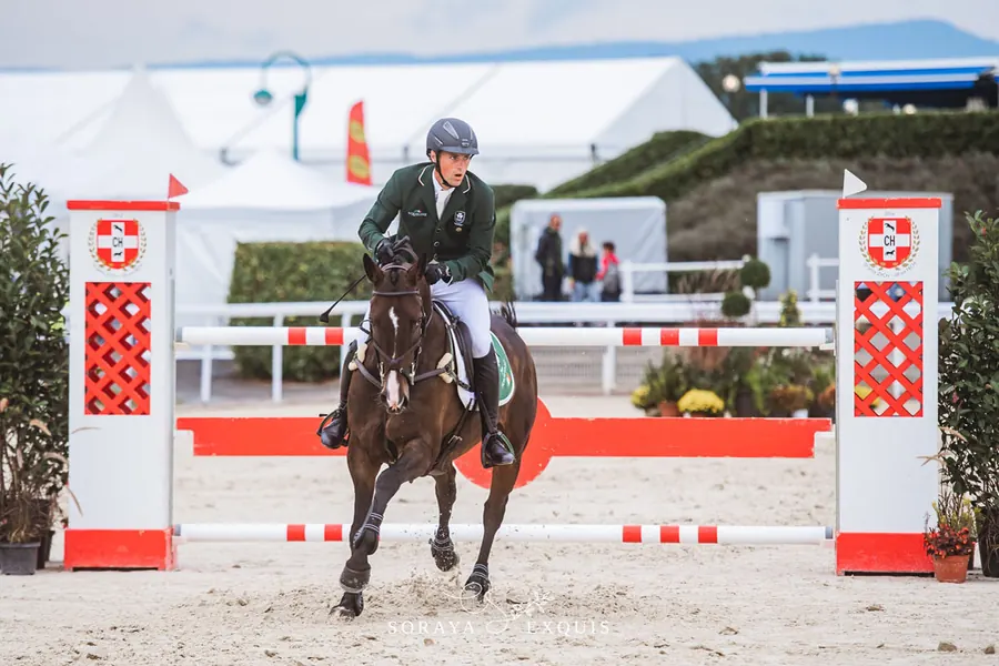Sam Watson riding cross-country at an eventing competition.