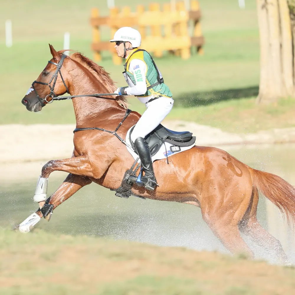 Andrew Hoy over a fence on the cross-country course at the Pratoni Eventing World Championships.
